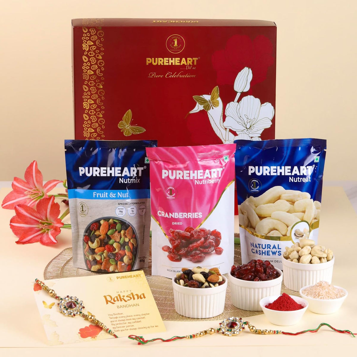 PUREHEART Rakhi Gift Hamper- Natural Cashews, Fruit & Nut Nutmix and Cranberries(80g, each) with Floral Rakhi for Brother, Gift Card, Pooja Rice, Kumkum - Crunchy Dry Fruits and Nuts