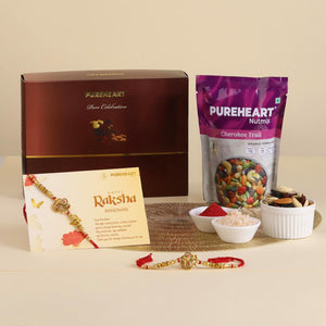 PUREHEART Rakhi Gift Hamper- Cherokee Trail Mix (80g) and Chocolates with Ganpati Rakhi for Brother, Gift Card, Pooja Rice, Kumkum - Crunchy Dry Fruits and Nuts