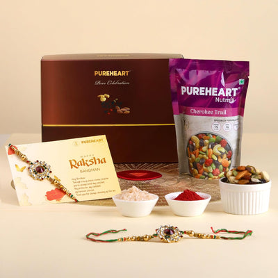 PUREHEART Rakhi Gift Hamper- Cherokee Trail Mix (80g) and Chocolates with Floral Rakhi for Brother, Gift Card, Pooja Rice, Kumkum - Dry Fruits and Nuts Gift