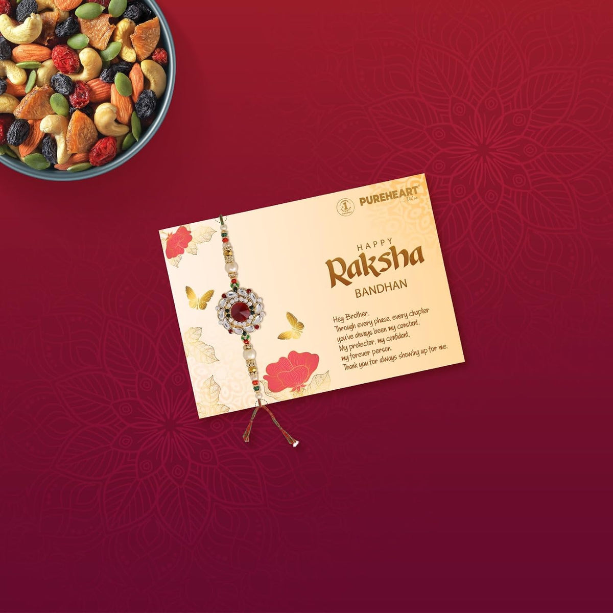 PUREHEART Rakhi Gift Hamper- Cherokee Trail Mix (80g) and Chocolates with Floral Rakhi for Brother, Gift Card, Pooja Rice, Kumkum - Dry Fruits and Nuts Gift