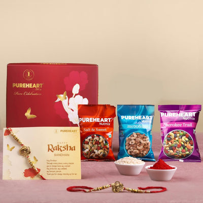 PUREHEART Rakhi Gift Hamper- Vanilla Cashew & Choco Almonds, Cherokee Trail Mix, Sweet & Salt Nutmix (25 g Each) with Chocolate and Floral Rakhi for Brother, Gift Card, Pooja Rice, Kumkum - Crunchy Dry Fruits and Nuts