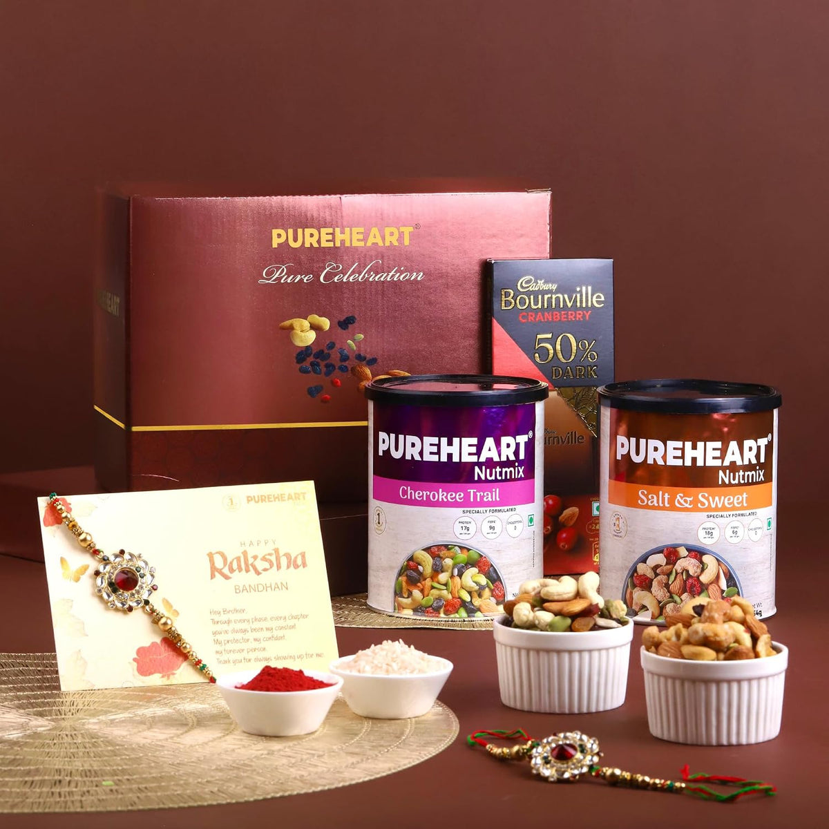 PUREHEART Rakhi Gift Hamper Cherokee Trail Mix, Sweet & Salt Nutmix (454g, each), Dark Chocolate with Rakhi for Brother, Gift Card, Pooja Rice, Kumkum