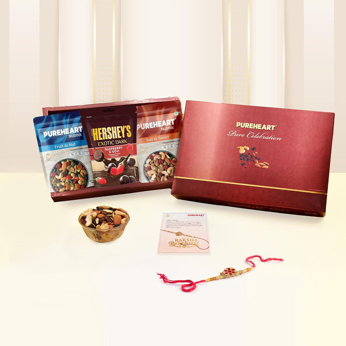 PUREHEART Rakhi Gift Hamper Combo of Natural Fruit & Nut Nutmix, Sweet & Salt Nutmix (80 g, each), Dark Chocolate with Floral Rakhi for Brother, Card, Pooja Rice, Kumkum